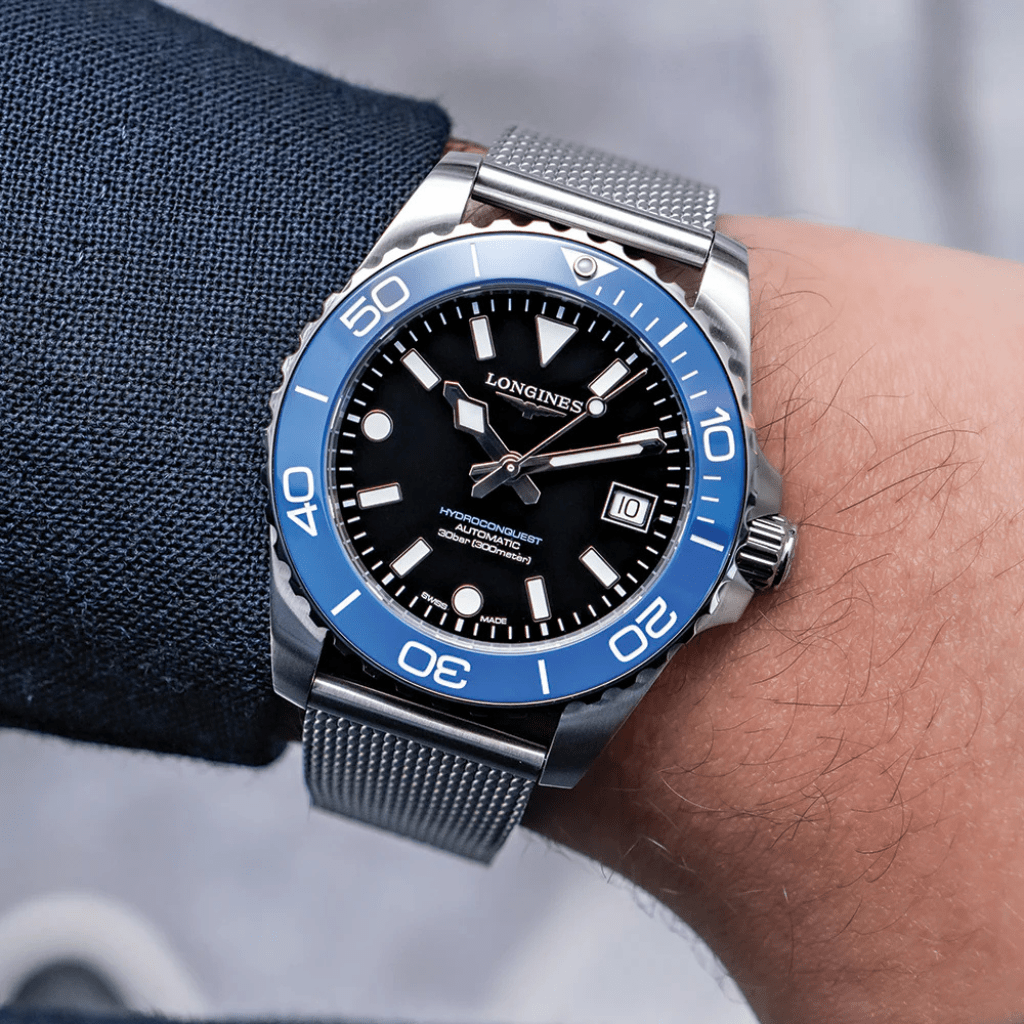 Longines Hydroconquest 42mm L3.788.4.90.6 acero, esfera negra, bisel cerámico azul brazalete milanesa